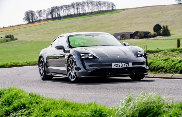 Grey Porsche Taycan turbo driving front