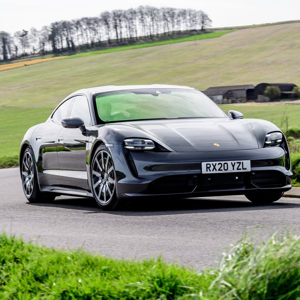 Grey Porsche Taycan turbo driving front