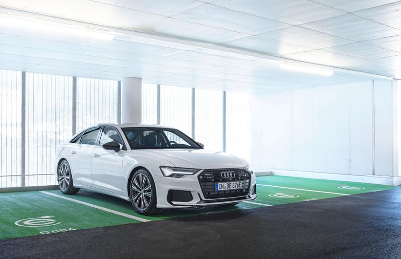 White Audi A6 parked in charging bay front and right side