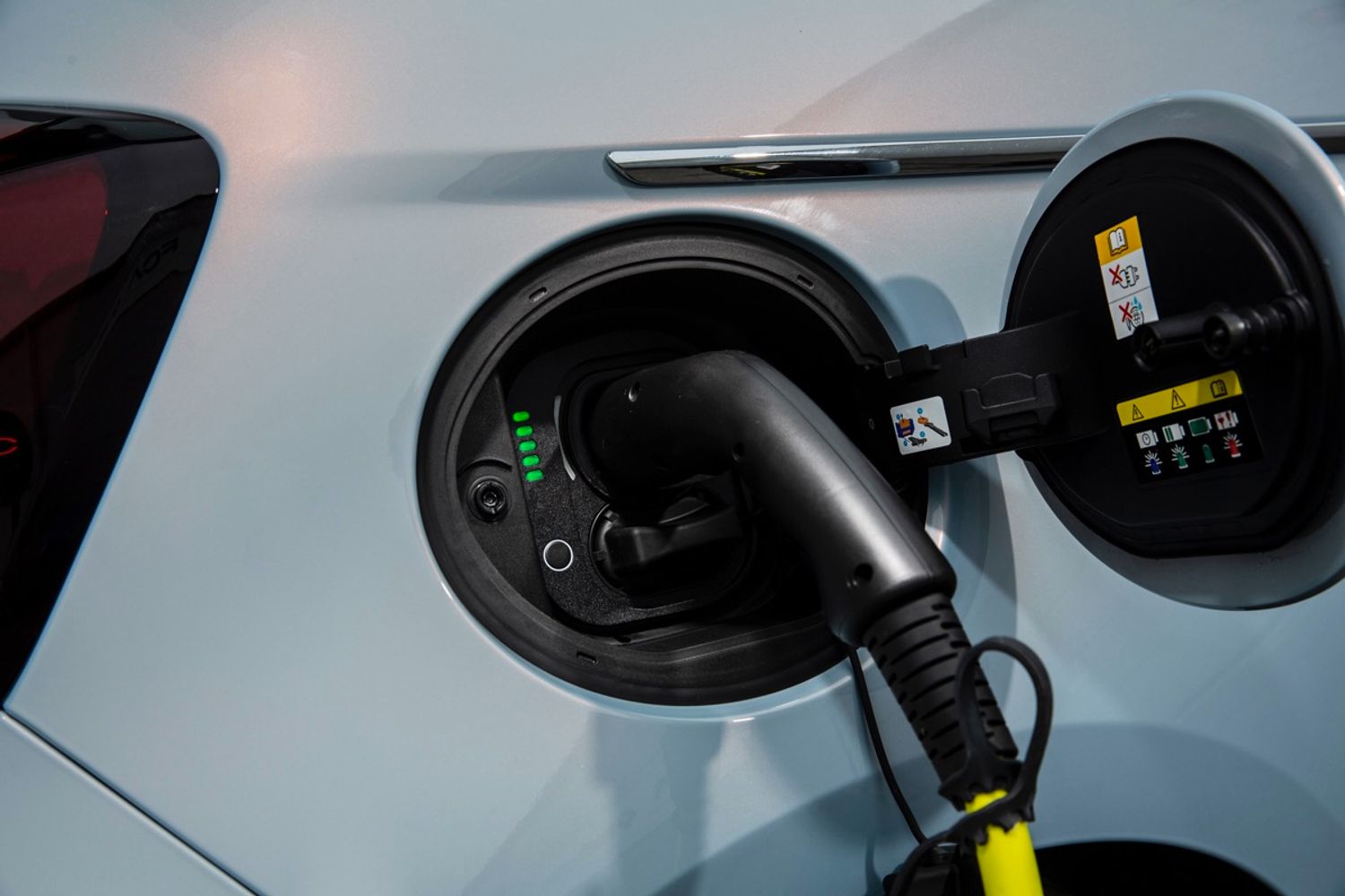 fiat 500 electric connected to charging cable