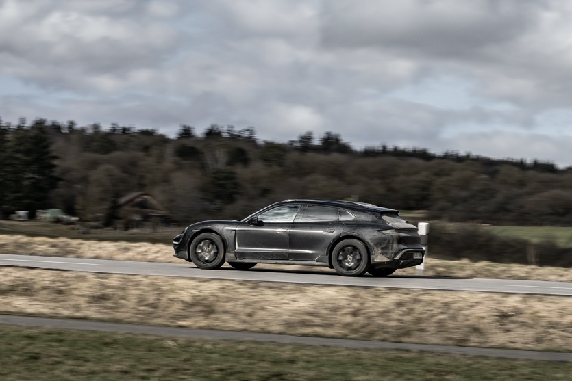 Porsche Taycan Cross Turismo driving in countryside