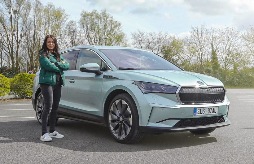 Ginny Buckley standing next to Skoda enyaq iV 