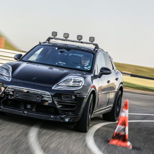 Porsche Macan electric prototype testing, disguised test car cornering on track