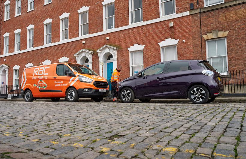RAC van (Ford Transit) on cobbled street, patrols rescuing a Renault Zoe