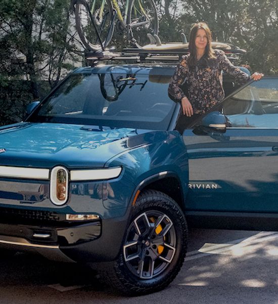 Rivian R1T in blue with Ginny Buckley