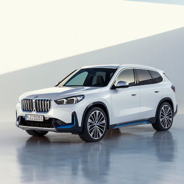 BMW iX1, German registered, studio static fron three quarters, white car