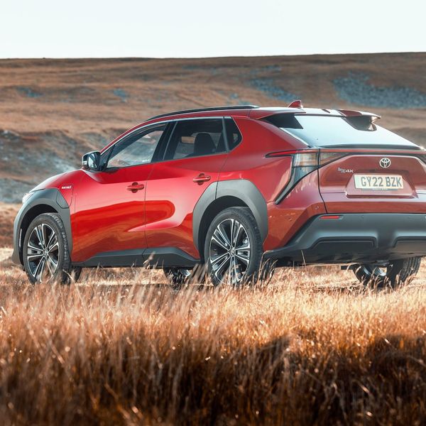 Toyota bZ4x static shot, rear, red car, RHD UK registration