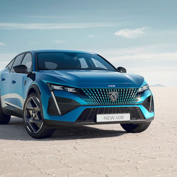 Peugeot 408 PHEV, front three quarters static, on dried lake bed, blue/green car