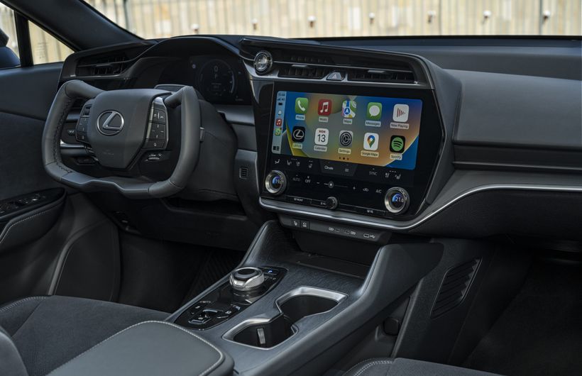 Lexus RZ 450e, interior showing Apple CarPlay on screen, with yoke drive by wire steering